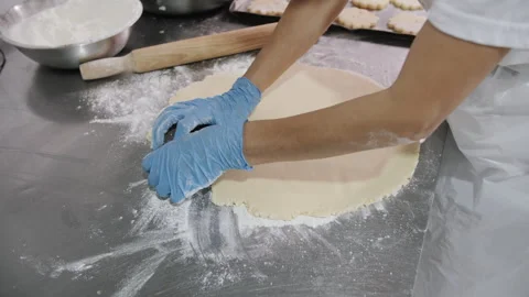 Baker Pressing Pie Crust, Gloved Hands. Bakery production. Stock Footage 321363211