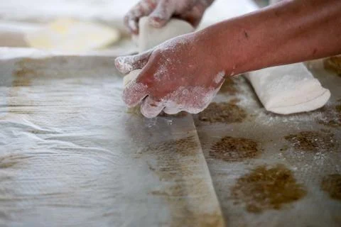 Baker Pulling Raw Ciabatta Bread Dough Stock-Fotos