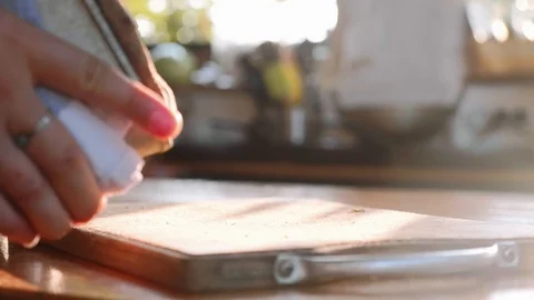 The baker pulls out the hot bread from the mold and puts it on the table. Stock Footage 100589797