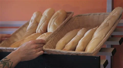 Baker put (and remove) a basket of braid on shelf Stock Footage 55503279