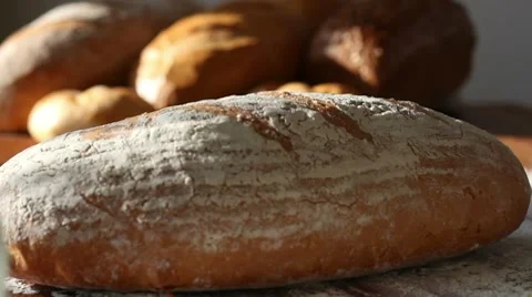 Baker put bread on table, close up HD Stock Footage 10725579