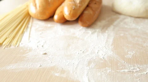 Baker put bread on table, close up, dolly shot Stock Footage 65513094