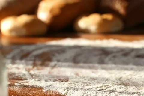 Baker put bread on the table, slow motion Stock Footage 10735050