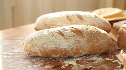 Baker put bread on table, slow motion, dolly shot Stock Footage 10735075