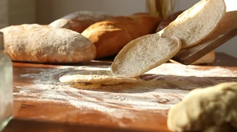 Baker put freshly made naan bread on the table, slow motion Stock Footage 10735306