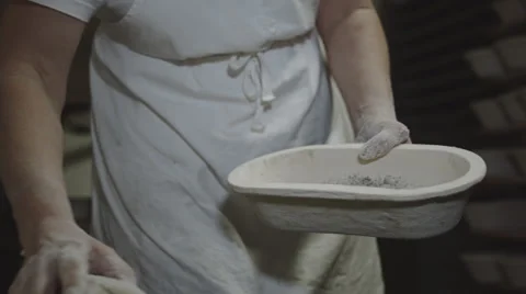 Baker puts Bread Dough in a bowl Stock Footage 66439490