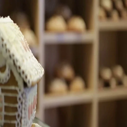 The baker puts bread on the shelves of his store Stock Footage 69484950