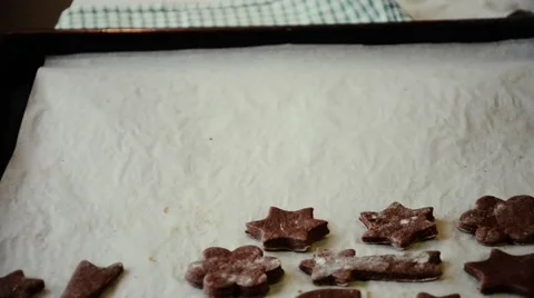 Baker puts cut gingerbread dough on a baking sheet. Christmas cookies Stock Footage 55099308
