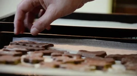 Baker puts cut gingerbread dough on a baking sheet. Christmas cookies Stock Footage 55127002