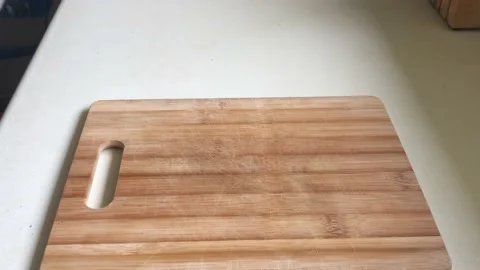 Baker puts freshly baked sourdough bread on wooden board. Stock Footage 162732753