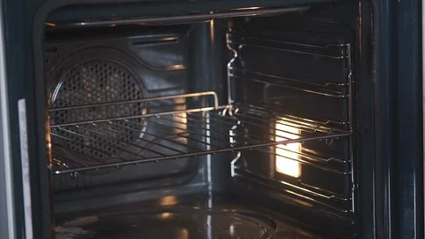 Baker puts pear cake in the baking dish into the oven. Pie and bakery products Stock Footage 124752460