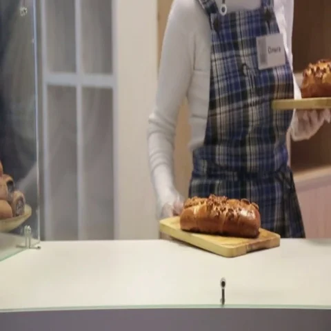 Baker puts pies in the shop window Stock-Footage 69484233