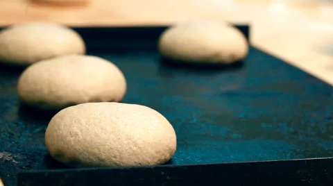 A baker is putting the pastry on a baking sheet Stock Footage 61265530