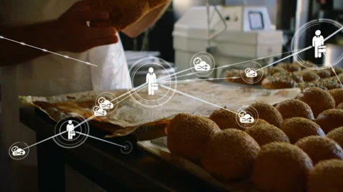 Baker reaching for braided loaf in bakery checking loaf while causing network 스톡 동영상 323272575