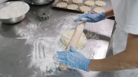 Baker Rolling Dough, Close-Up. Bakery production Stock Footage 321363287