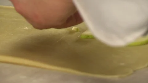 Baker rolling dough with rolling pin Stock Footage 84171435