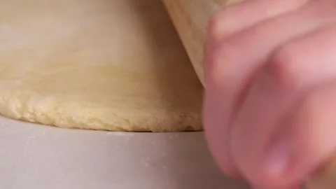 Baker rolling dough with rolling pin in slow motion Video stock 305877809