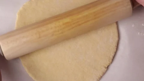 Baker rolling dough with rolling pin in slow motion Stock Footage 305878125