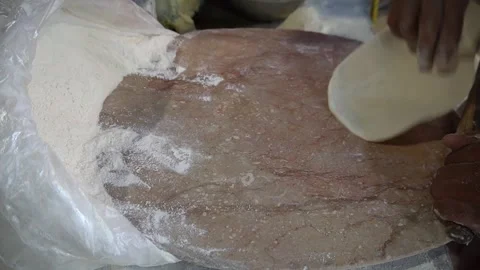 Baker Rolling Out White Dough Chapati With Wooden Pin on Marble Table Stock Footage 340480491