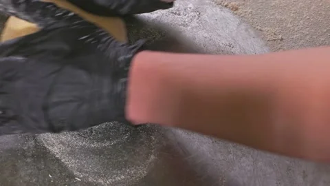 The baker rolls the dough to make the bread. Stock Footage 155522794