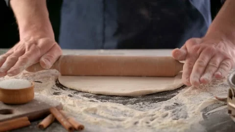 Baker rolls dough with rolling pin Stock-Footage 130531965