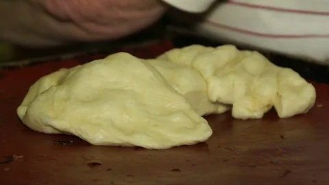 Baker rolls the dough into a rope hands Vídeos de archivo 73588243