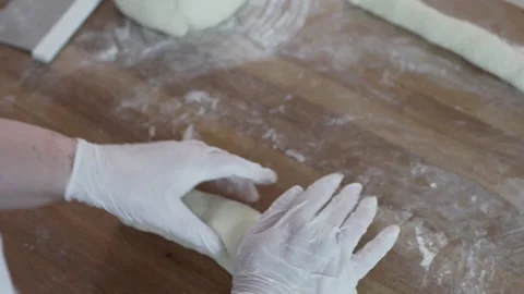 Baker rolls out the dough close up Stock-Footage 130356826