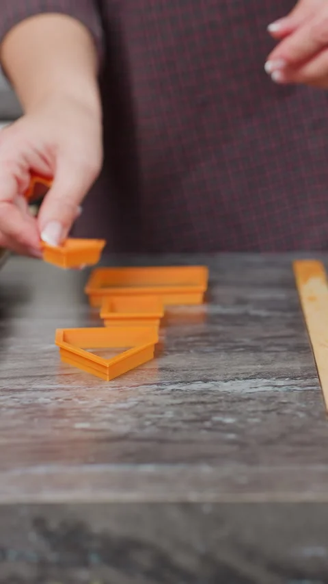Baker Setting Baking Shapes on Countertop for Pastry Prep Stock Footage 320339938