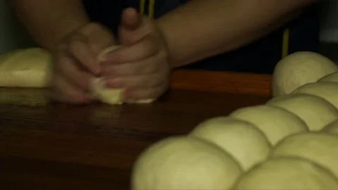 Baker shaping the dough in a bakery Stock Footage 71967743
