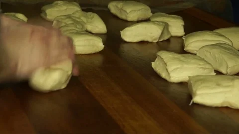 Baker shaping the dough Stock Footage 71967650