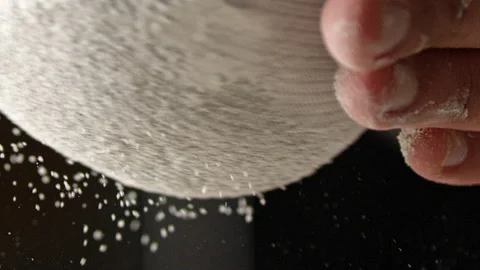 Baker sifting flour on the table Stock Footage 274689084