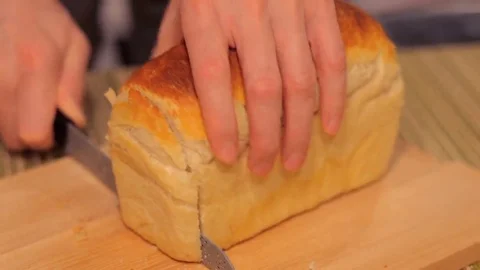 Baker sliced fresh hot crisp fragrant white bread homemade. Video stock 69297928