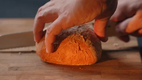 Baker slices crisp bread warm and delicious homemade loaf restaurant chef Video stock 129574362
