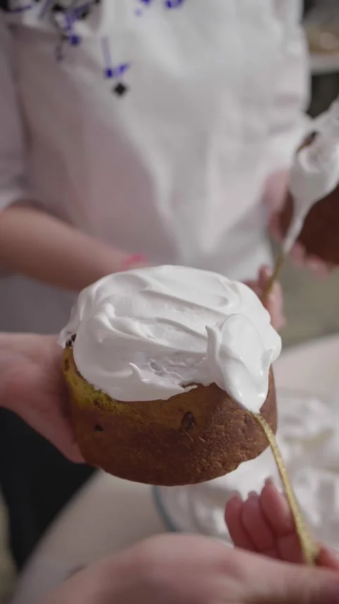 Baker Spreading Royal Icing on Traditional Easter Bread Stock Footage 341417585