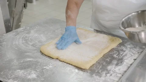 Baker Sprinkling Sugar Over Dough Video stock 321544896