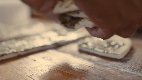 Baker stacking strips of seasoned dough Stock Footage 274681187