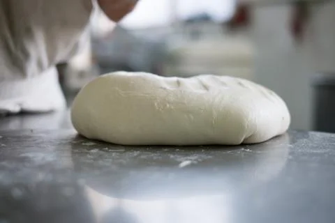 Baker Steping up to  Fresh Bread Dough Stock Photos