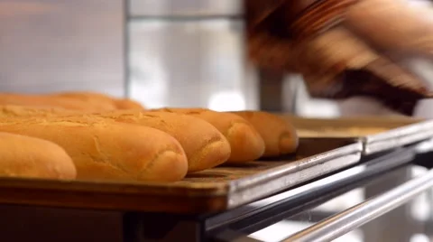 Baker take baguette on shelf Vídeos de archivo 59579284