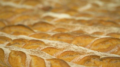 The baker takes bread out of the oven. Ready-made bakery products. Stock Footage 82716660
