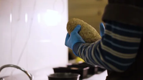 Baker turns in the hands of the dough for bread Stock Footage 106458859