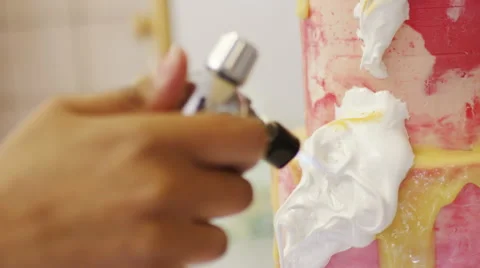 Baker using cook's blowtorch to toast meringue on a cake, in slow motion Stock Footage 61580007