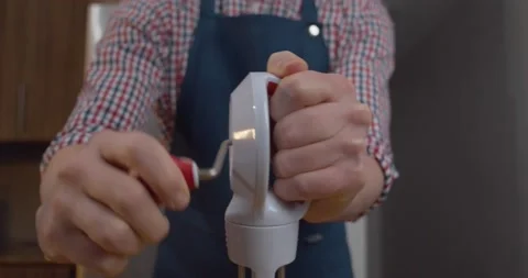 Baker using hand mixer Stock Footage 147259670