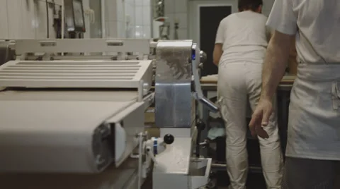 Baker walks to a Machine Stock Footage 66452132