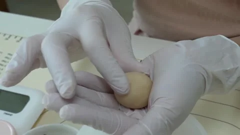 Baker in White Gloves Rolling Dough into a Perfect Ball close up Video stock 345293453