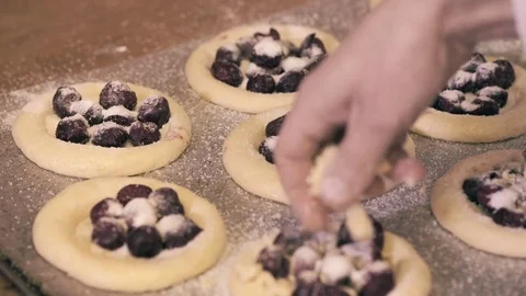 Baker woman forms pie on a table. Hands slowmo Stock Footage 75048233