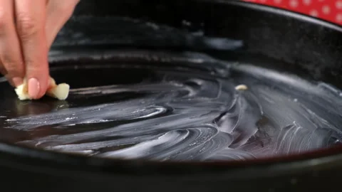Baker woman hands greasing cake mold with butter cooking pastry. Stock Footage 311528879