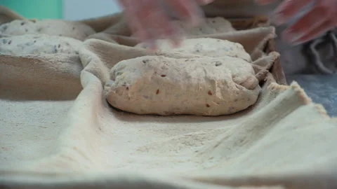 Baker at work. The baker shapes the bread Stock Footage 196243135
