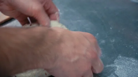 Baker at work. The baker shapes the bread Video stock 196243431
