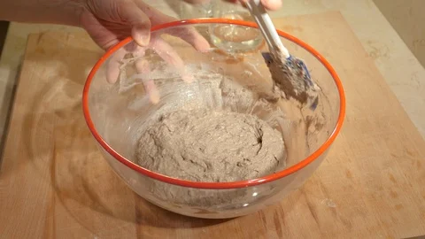 Baker at work: Knead the bread in a glass bowl Stock Footage 86865643