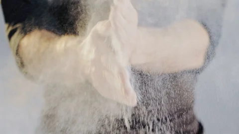 Baker working with dough. Clapping hands with flour, folding dough. Stock Footage 104720125